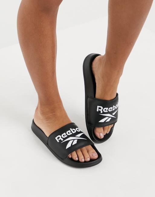 Reebok logo sliders in black | ASOS