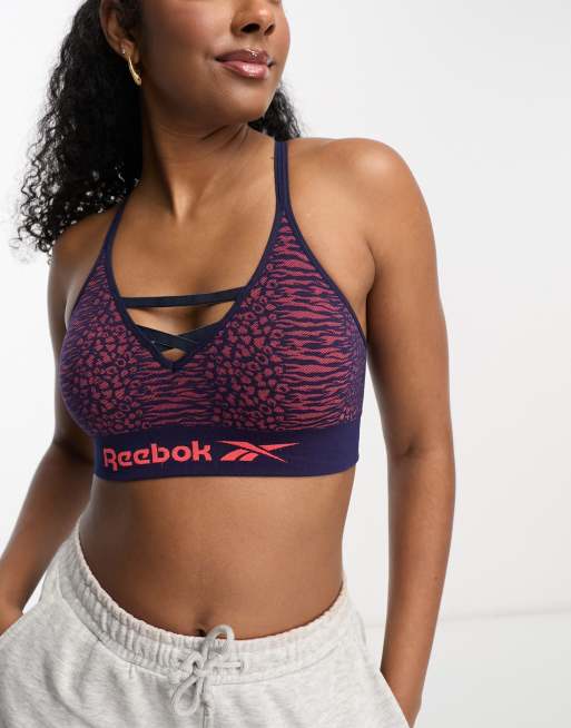 Reebok - Maryna - Sømløs croptop med stropper i marineblåt og orange dyreprint