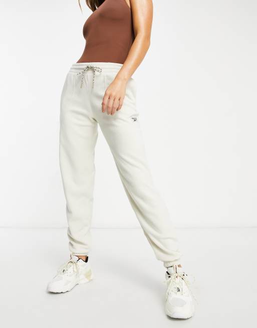 Reebok Pantalon de jogging en polaire avec poche Beige