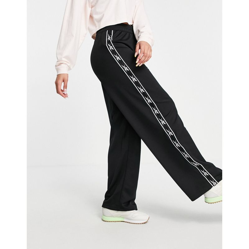 Pantaloni con fondo ampio Pantaloni e leggings Reebok - Pantaloni a fondo ampio neri con logo