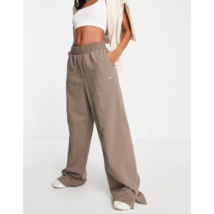 Reebok pantaloni verdi new arrivals