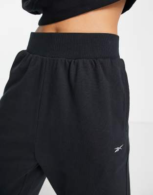 pantaloni neri reebok