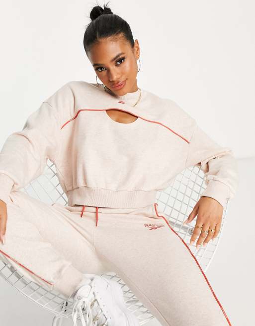 Reebok piping sweatshirt with cut out detail in pale pink | ASOS