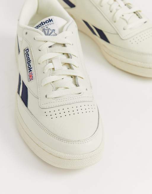 Reebok revenge plus trainers in off white with cheap navy stripe