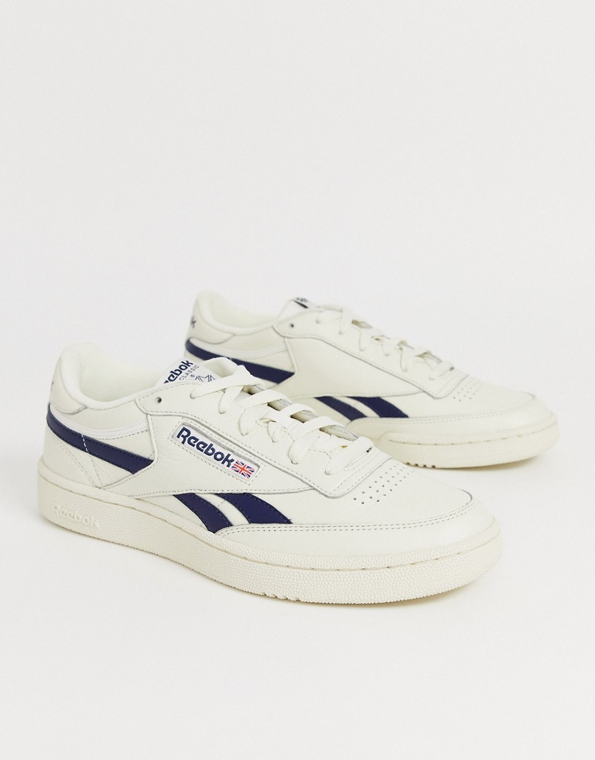 Reebok revenge plus trainers in off white with navy stripe