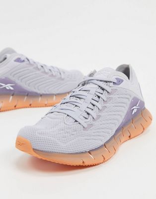 purple reebok running trainers