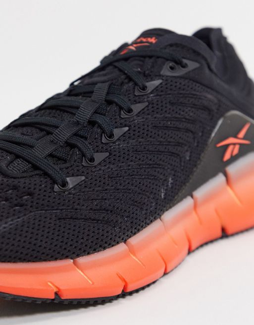 Black and Orange Reebok New Zig Sneakers Size 3.0