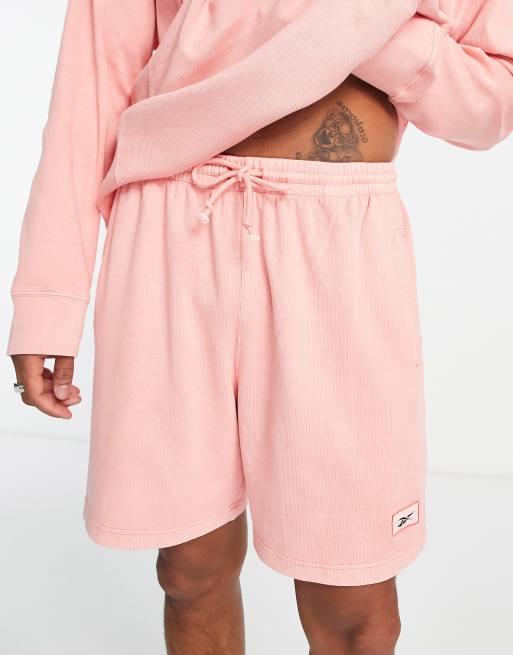 Reebok – Shorts in loderndem Halb-Orange - LPINK