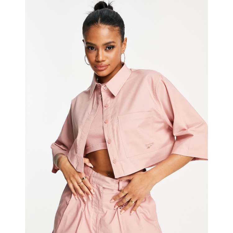 Pink reebok hot sale shirt