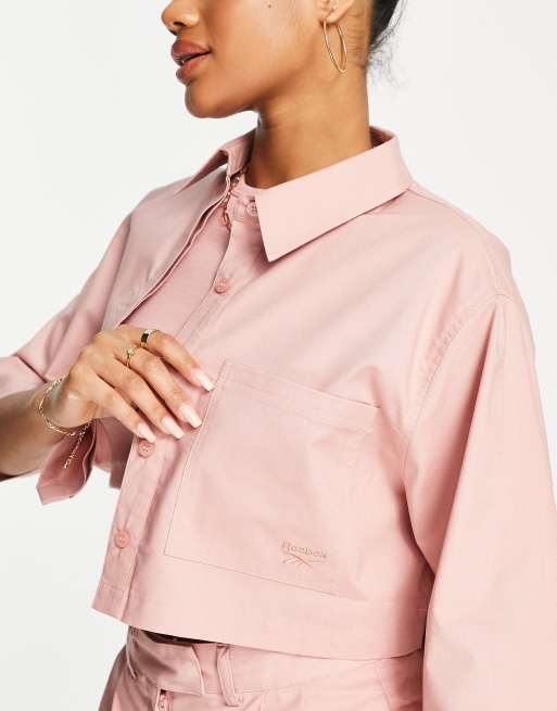 Reebok best sale pink shirt