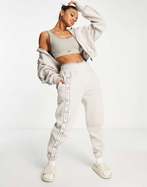 Reebok trackies in oatmeal with taping