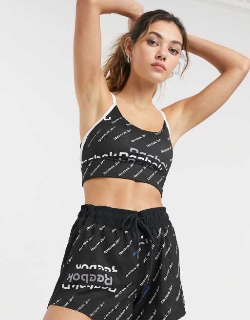 Reebok training bra and leggings in black all over logo | ASOS