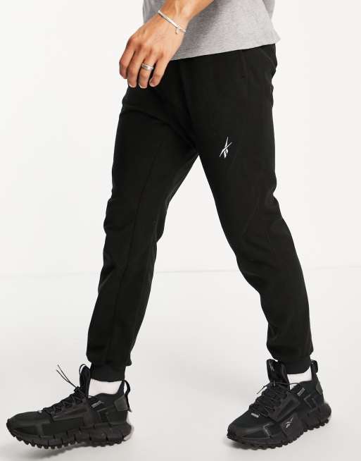 Reebok Training fleece joggers with logo in black | ASOS