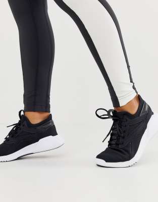 reebok training freestyle motion trainers in black