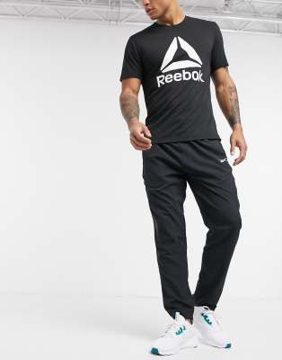 Reebok Training trackies in black - ASOS Price Checker