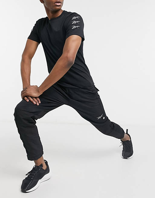 Men Reebok Training logo joggers in black 