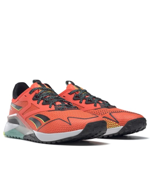 Orange reebok sale trainers