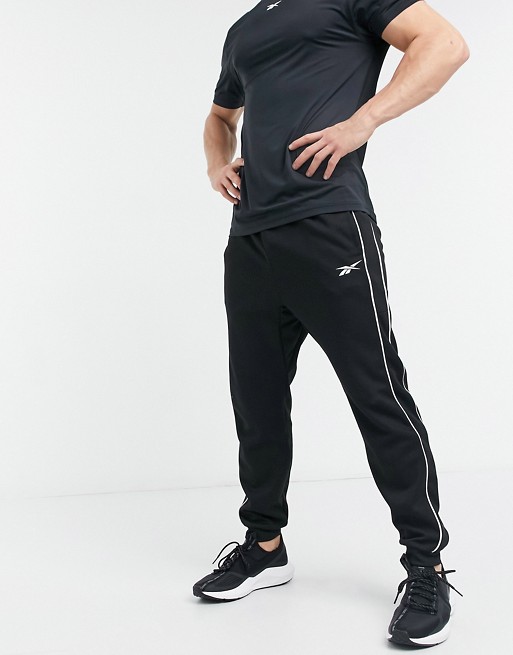 Reebok Training piped joggers in black
