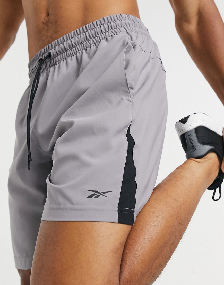 Reebok Training shorts in grey with side split