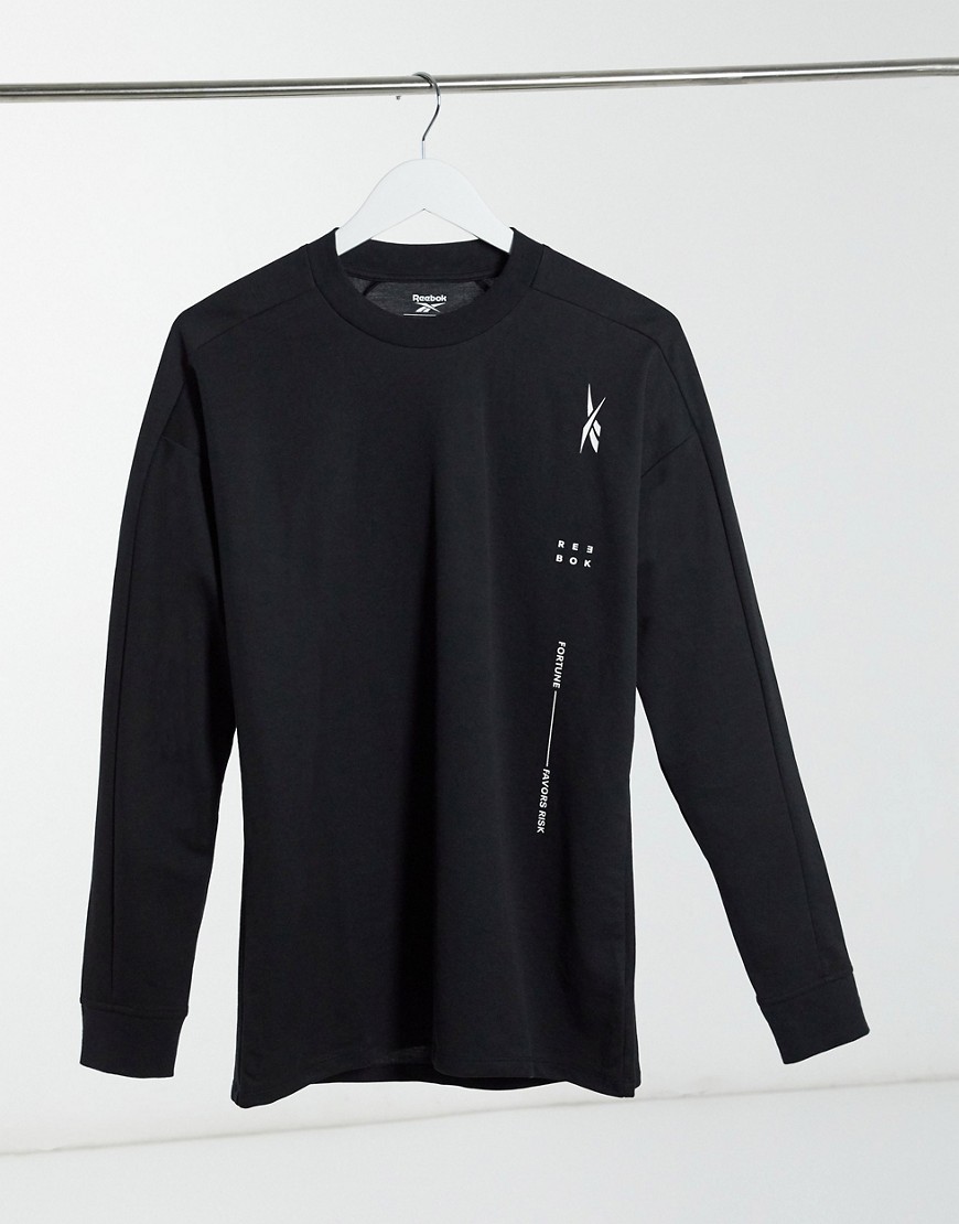 Reebok Training sweatshirt in black with pocket detail