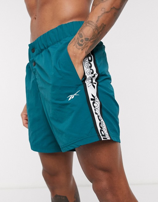 Reebok Training woven shorts with logo taping in teal