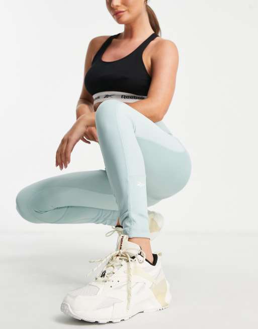 https://images.asos-media.com/products/reebok-yoga-studio-ribbed-detail-high-waisted-leggings-in-blue/202188827-4?$n_640w$&wid=513&fit=constrain