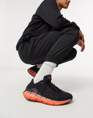 orange reebok sneakers