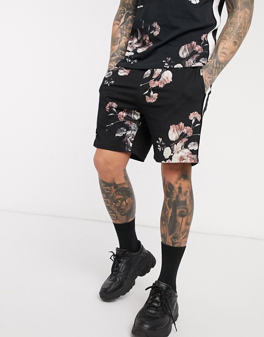 Religion all over floral print jersey shorts with leg taping in black