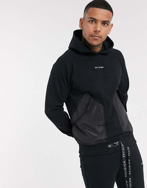 Religion hoodie with utility contrast pockets in black