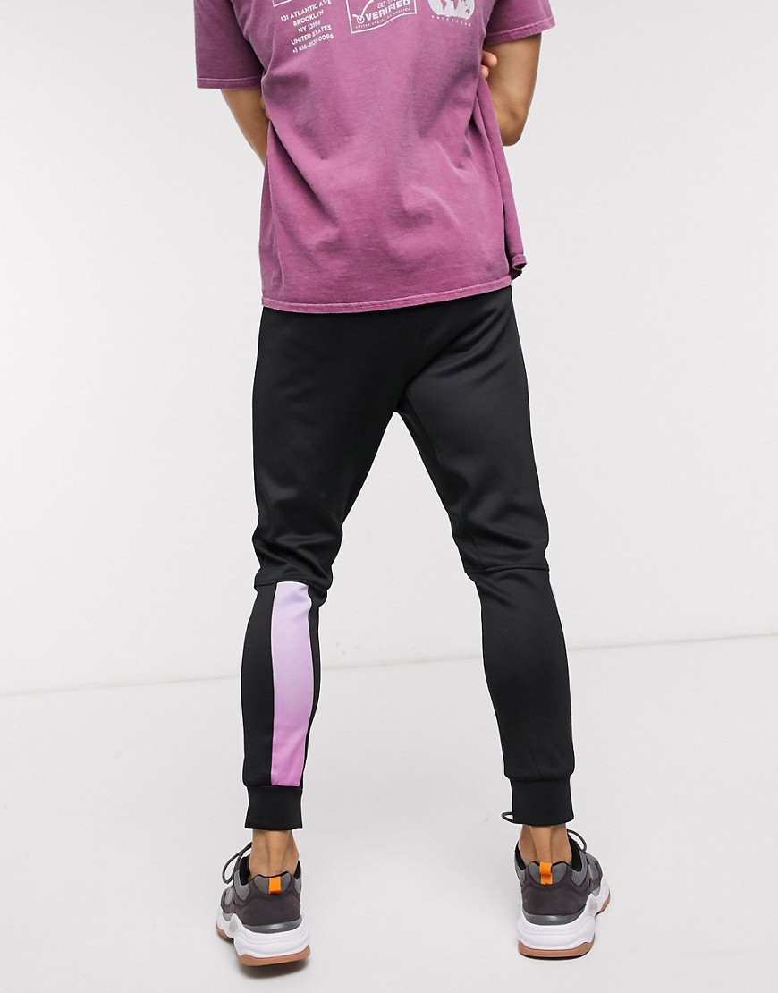 Religion - Joggers skinny in tricot di poliestere neri con fettuccia colorata sfumata-Nero