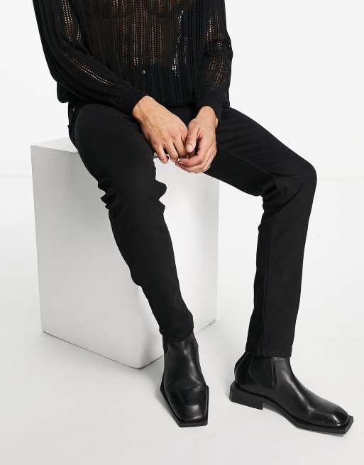 Religion – Schmal zulaufende Jeans in Schwarz