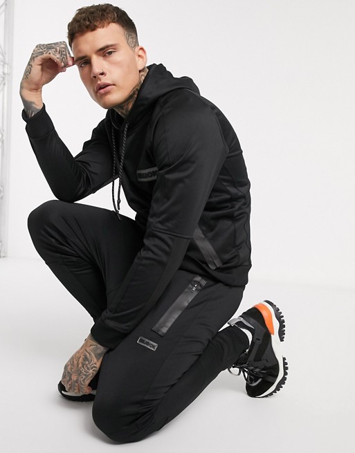 Religion skinny fit polycot jogger with rubberised logo in black