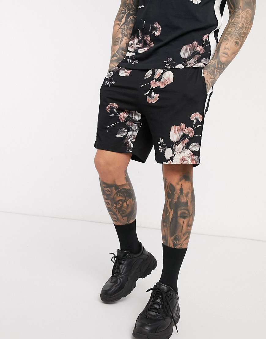 Religion – Svarta blommiga jersey-shorts med tejpade detaljer på benen