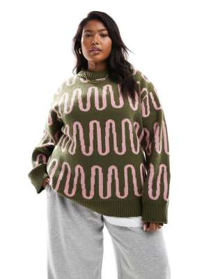Renee Studio Plus x Holly Wynne - Exklusiver Pullover in Grün mit abstraktem rosa Muster und hohem, geripptem Kragen-Bun...