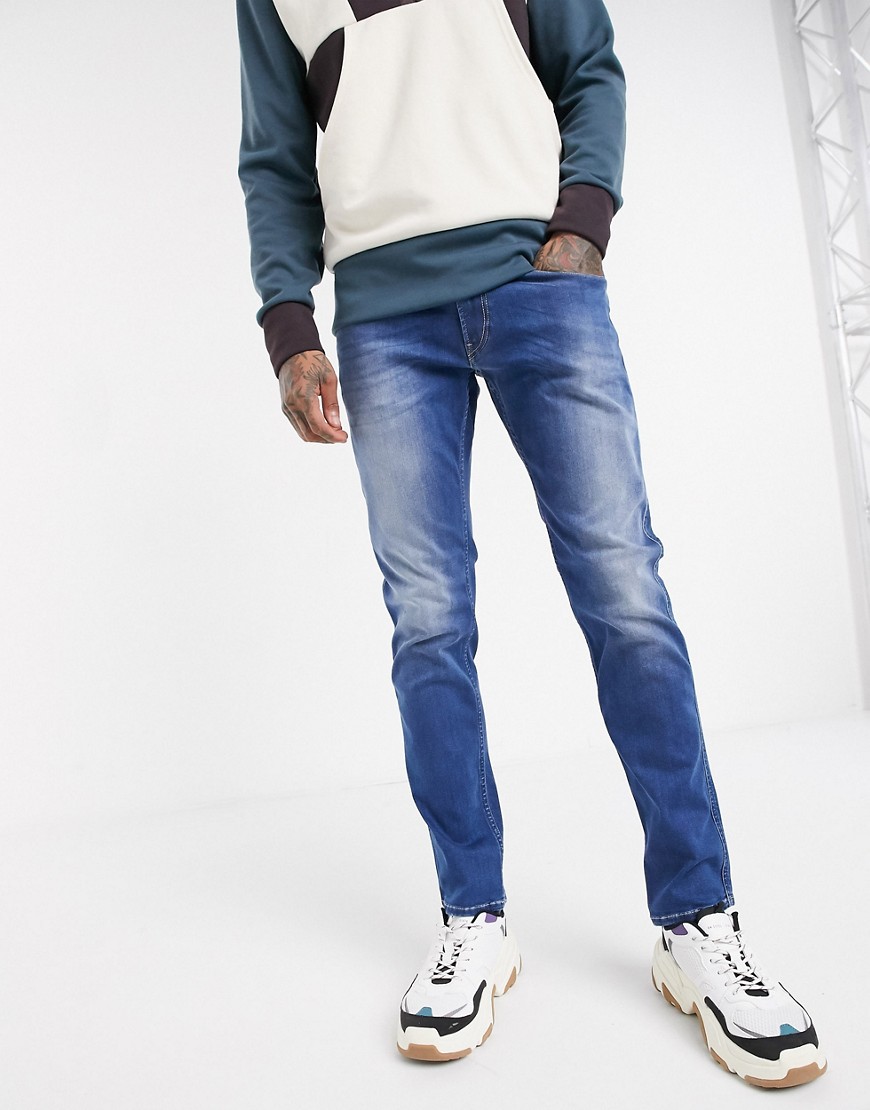 Replay – Anbass – Mellanblå slim jeans med powerstretch