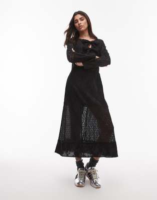 Robe longueur mollet en broderie anglaise nouée sur le devant - Noir 42