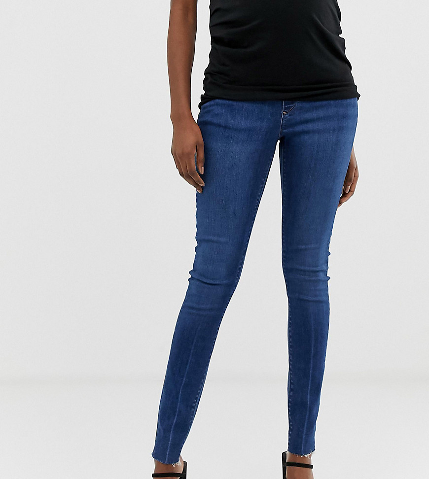 Ridley højtaljede skinny jeans i mørkeblå stenvask med rå kant fra ASOS DESIGN Maternity