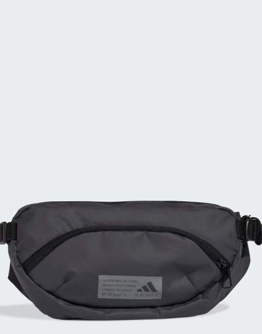 Riñonera gris carbón y negra con diseño híbrido de adidas Performance