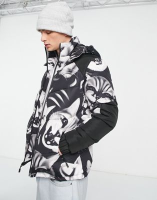 RIPNDIP neon cat hooded puffer jacket in black with all over cat print
