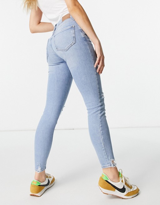 River Island Amelie ripped knee raw hem skinny jeans in light auth blue