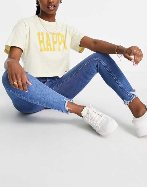 River Island - Amelie - Skinny jeans en onafgewerkte rand in mid wash, 4 van 4