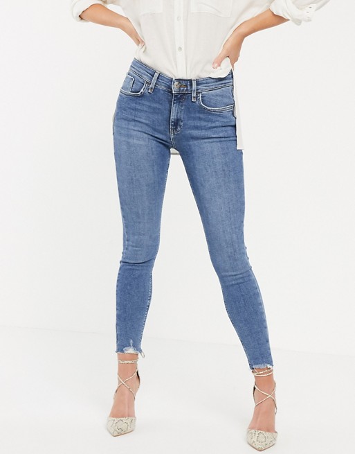 River Island Amelie skinny jeans with raw hem in mid blue