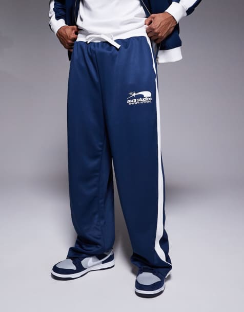 River Island 'Aura Studios' track joggers in navy and white - view 1