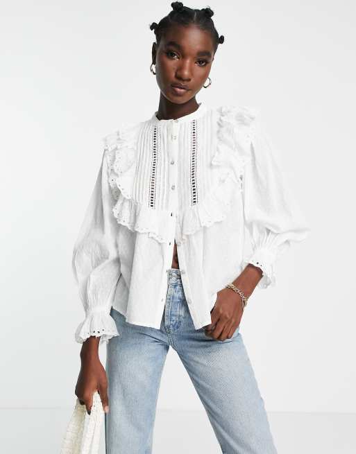 River Island – Biała bluzka z falbanką i angielskim haftem