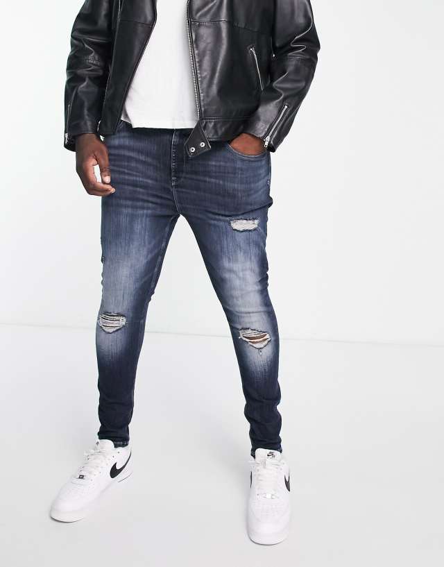 River Island Big & Tall spray-on jeans in dark blue