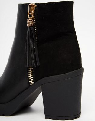 black boots with gold zip