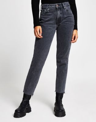 cutting raw hem jeans
