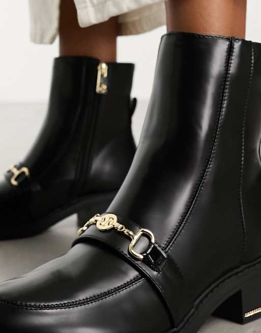 Black boots with gold sales accents