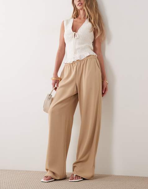 River Island – Bruna, mjuka byxor i crêpe med vida ben och elastisk midja - view 1