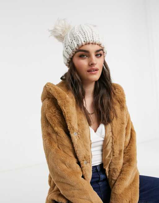 River Island cable knit double faux fur pompom beanie hat in beige